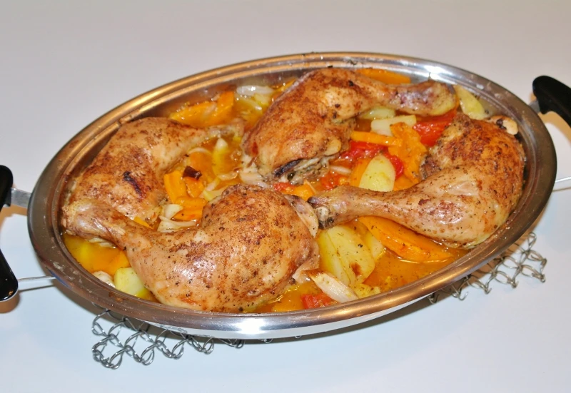 Geschmorte Hendlkeulen mit Tomaten, K&uuml;rbis und Kartoffeln
